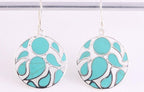 Ronde opengewerkte zilveren oorbellen met groene turkoois afbeelding 4