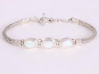 Traditionele zilveren snake armband met welo opaal afbeelding 1