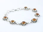 Bewerkte zilveren armband met amber afbeelding 2