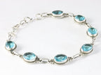 Bewerkte zilveren armband met blauwe topaas afbeelding 2