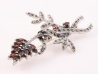 Grote zilveren broche met granaat en marcasiet afbeelding 3