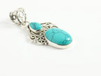 Opengewerkte zilveren hanger met turkoois aan ketting afbeelding 2