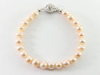 Armband met natuurlijke roze zoetwater parels en zilveren sluiting afbeelding 1