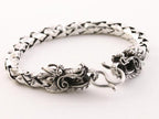 Zware zilveren armband met drakenkoppen en schubbenschakels afbeelding 2