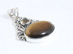 Opengewerkte zilveren hanger met tijgeroog en rookkwarts afbeelding 2