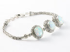 Traditionele bewerkte zilveren armband met welo opaal en koningsschakels afbeelding 2