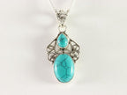 Opengewerkte zilveren hanger met turkoois aan ketting afbeelding 4