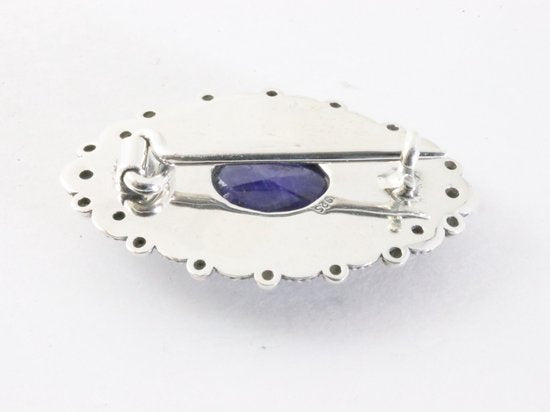 Bewerkte zilveren broche met blauwe saffier afbeelding 3