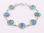 Bewerkte zilveren schakelarmband met blauwe chalcedoon afbeelding 1