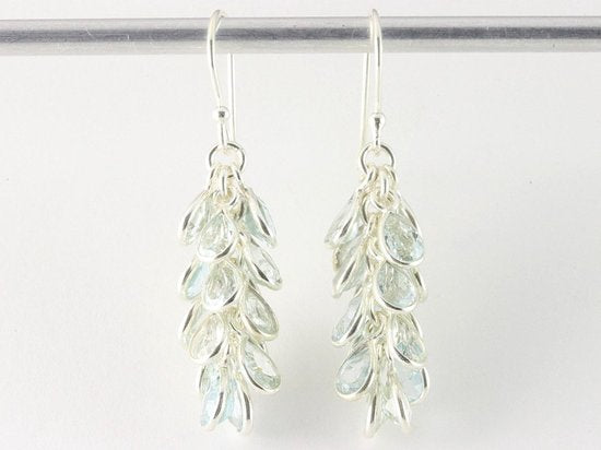 Trosvormige zilveren oorbellen met blauwe topaas afbeelding 3