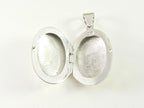Ovaal bewerkt zilveren medaillon afbeelding 5