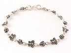 Fijne zilveren armband met vlinders en roosjes afbeelding 1