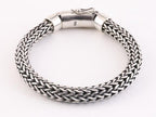 Zware ronde gevlochten zilveren armband met kliksluiting afbeelding 2