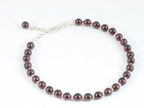 Armband van granaat en zilveren kralen afbeelding 1