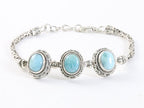 Traditionele bewerkte zilveren armband met larimar en koningsschakels afbeelding 1