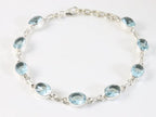 Hoogglans zilveren armband met blauwe topaas afbeelding 1