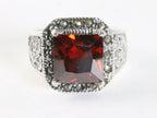 Opengewerkte zilveren ring met granaat en marcasiet afbeelding 4