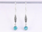 Lange fijn bewerkte zilveren oorbellen met turkoois afbeelding 4