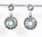 Ronde bewerkte zilveren oorstekers met blauwe topaas afbeelding 1