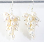 Trosvormige zilveren oorbellen met witte zoetwater parels afbeelding 1