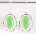 Opengewerkte zilveren oorbellen met groene opaal afbeelding 1