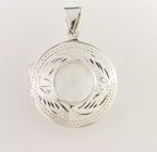 Rond bewerkt zilveren medaillon met parelmoer afbeelding 1
