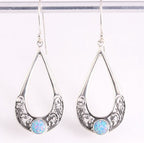 Opengewerkte zilveren oorbellen met Australische opaal afbeelding 1