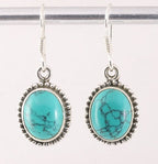 Bewerkte ovale zilveren oorbellen met turkoois afbeelding 1
