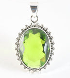 Bewerkte zilveren hanger met peridoot afbeelding 1