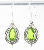 Bewerkte zilveren oorbellen met peridoot afbeelding 1