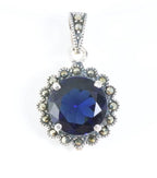Ronde zilveren hanger met blauwe saffier en marcasiet afbeelding 1