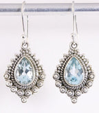 Bewerkte zilveren oorbellen met blauwe topaas afbeelding 1