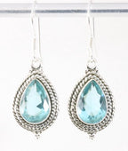 Bewerkte zilveren oorbellen met blauwe topaas afbeelding 1