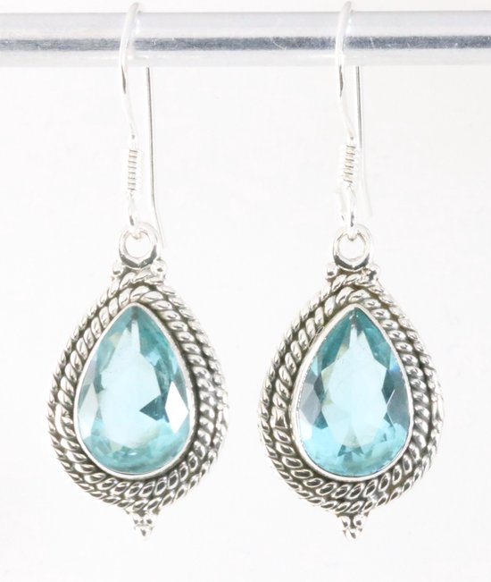 Bewerkte zilveren oorbellen met blauwe topaas afbeelding 1