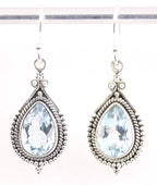 Bewerkte zilveren oorbellen met blauwe topaas afbeelding 1