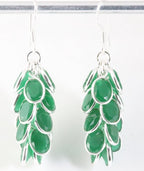 Trosvormige zilveren oorbellen met smaragd afbeelding 1