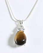 Zilveren hanger met tijgeroog en witte topaas aan ketting afbeelding 1