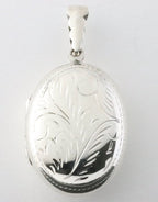 Groot ovaal bewerkt zilveren medaillon afbeelding 1