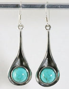 Lange druppelvormige zilveren oorbellen met turkoois afbeelding 1