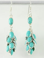 Trosvormige zilveren oorbellen met turkoois afbeelding 1