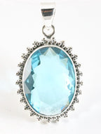 Bewerkte zilveren hanger met blauwe topaas afbeelding 1