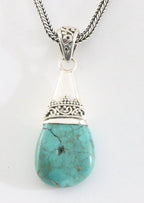 Traditionele bewerkte zilveren hanger met Tibetaanse turkoois aan ketting afbeelding 1