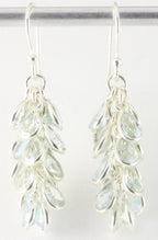 Trosvormige zilveren oorbellen met blauwe topaas afbeelding 1