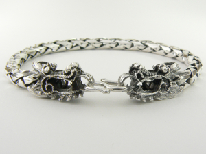 30174 Zware zilveren schakelarmband met draken