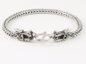 31164 Gevlochten zilveren armband met drakenkoppen