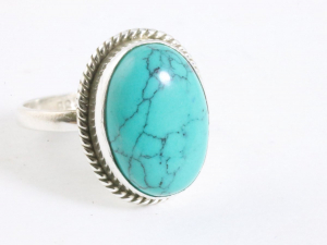 24702 Bewerkte ovale zilveren ring met turkoois