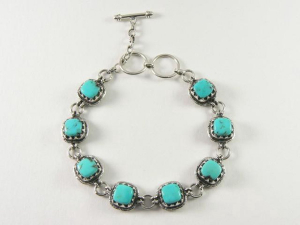 30155 Bewerkte zilveren schakelarmband met turkoois
