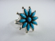 20312 Zilveren ring in de vorm van een bloem met blauwe turkoois stenen