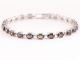 31303 Zilveren tennisarmband met rookkwarts