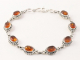 31968 Bewerkte zilveren armband met amber